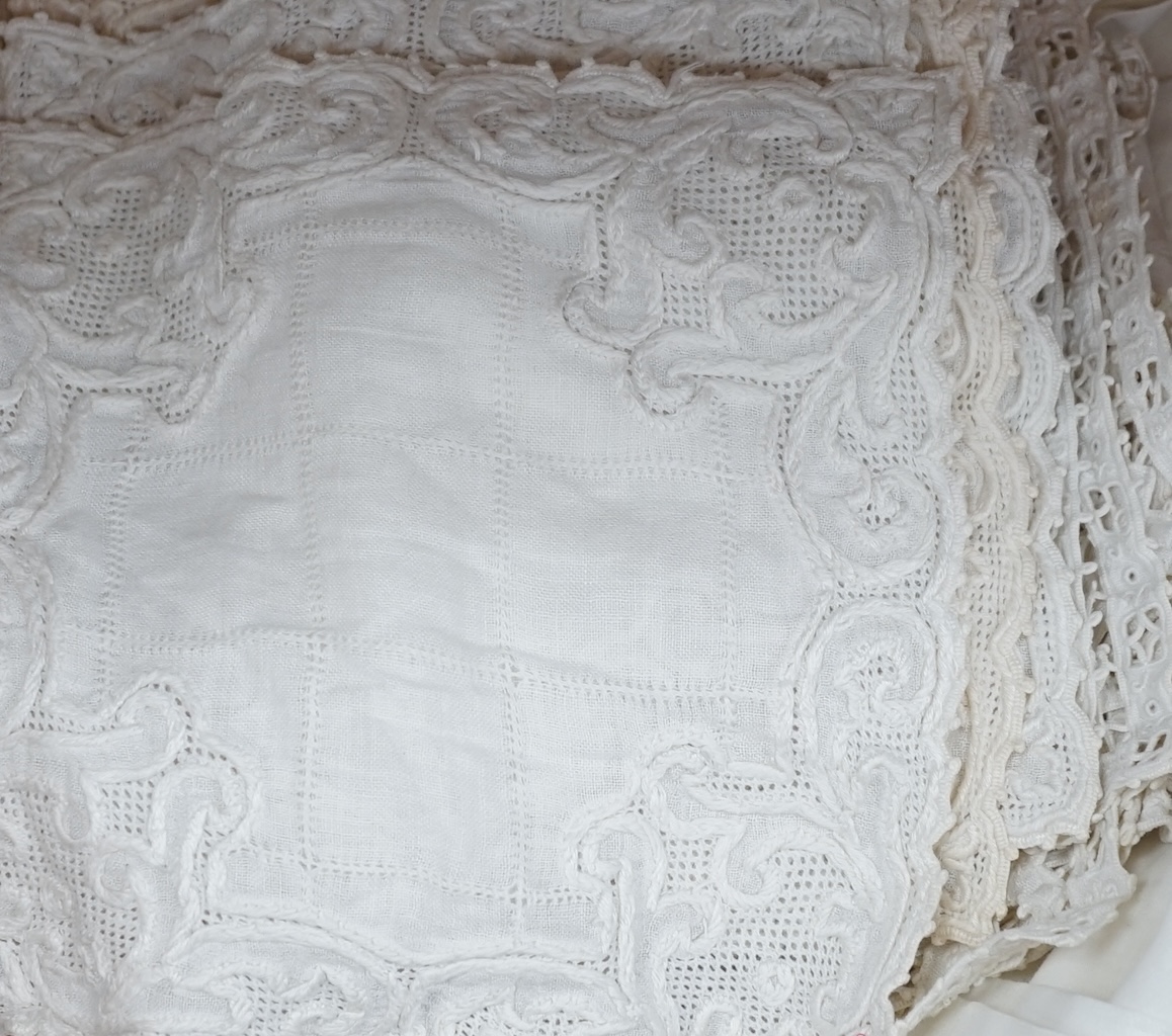 Cutworked table mats and place mats, two crocheted table cloths, a Madeira embroidered table set etc